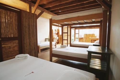 - une chambre avec 2 lits dans l'établissement La Fauna Hotel, à Puerto Maldonado