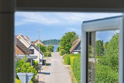a view from a window of a street at Beautiful Yellow Country Villa By The Water in Millinge