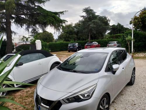 two white cars parked next to each other at La dimora di nonna Giuliana in Ostuni