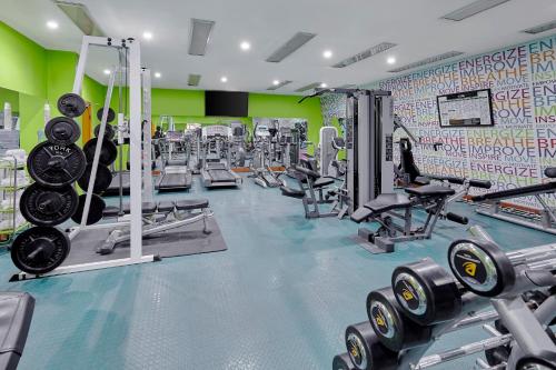 a gym with treadmills and weights at Holiday Inn Tabuk by IHG in Tabuk