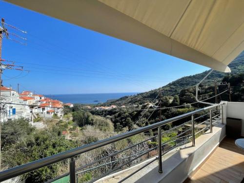 a balcony with a view of the ocean at Myrtoan Sea View Apartment in Velanídhia