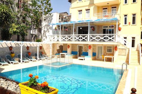 a large swimming pool in front of a building at Room in Apartment - Beautiful Holiday Home In Resort Centre in Side
