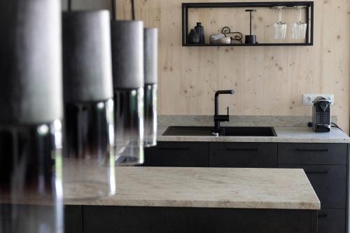 a kitchen with a sink and a counter top at Widderkopf in Oberstaufen