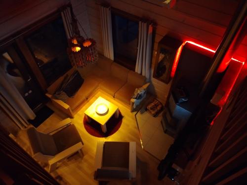 an overhead view of a living room with a table and chairs at Ruka Star in Ruka
