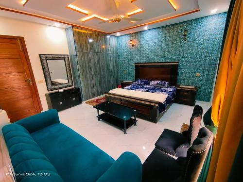 a living room with a bed and a couch at 2 bedroom Independent house Valencia town Lahore in Lahore