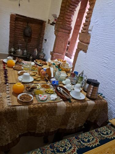 a table with food and drinks on it at Dar Si hmed in Rabat