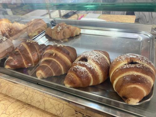 a tray of pastries on display in a bakery at Four Islands - Pozzuoli in Pozzuoli
