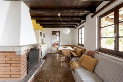 a living room with a couch and a fireplace at Oasi di pace vista lago-Cardada-Locarno in Orselina