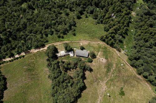 an aerial view of a house in the middle of a forest at Oasi di pace vista lago-Cardada-Locarno in Orselina