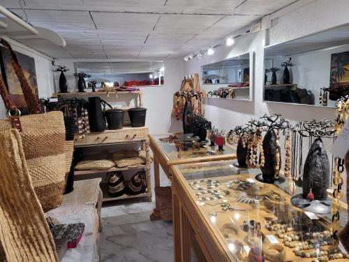 a room filled with lots of vases and other items at Villa Rasoa in Cap d'Agde