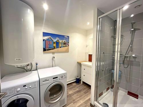 a bathroom with a washing machine and a shower at Maison de ville à Berck Plage, terrasse et garage, proche plage et commerces - FR-1-646-65 in Berck-sur-Mer