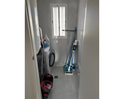 a bathroom with two mopicans in a room at Oasis Beach 13 Casa del Guardamar in Alicante