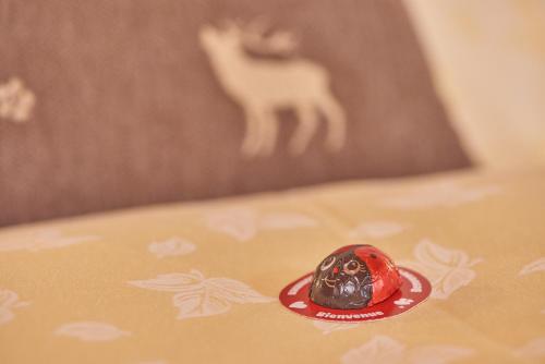 a red bead sitting on top of a table at Landhaus Lenzenhof in Reit im Winkl
