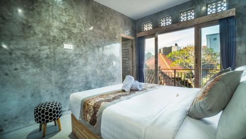 Postel nebo postele na pokoji v ubytování Skyline House Ubud View by EPS