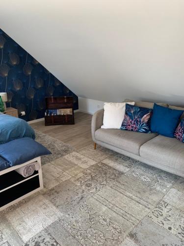 a living room with a couch and a rug at Alain in Vouzon