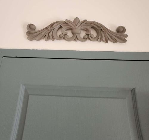 a door with a wooden frame above it at Le Clos Renaissance in Oppède