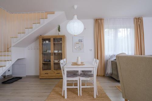 a white table and chairs in a living room at Piramida Visoko in Visoko