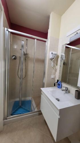 a bathroom with a shower with a glass door at ilgecotds in Torino di Sangro
