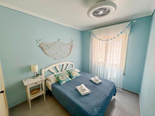 En eller flere senge i et værelse på Casa Marina