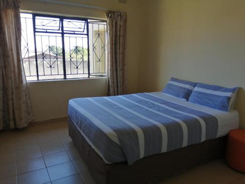 Krevet ili kreveti u jedinici u okviru objekta Mabwe Guest House