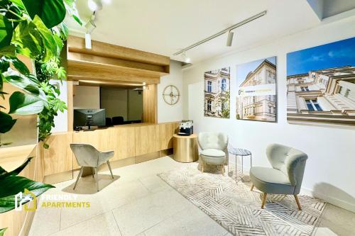 a lobby with chairs and a waiting room at SERENITY Residence - Old Town Poznan by Friendly Apartments in Poznań