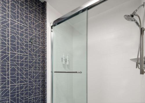 a shower with a glass door in a bathroom at Homewood Suites by Hilton Chester in Chester