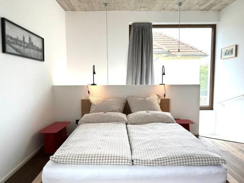 a bedroom with a large bed with two tables at Cologne Country Lodge in Cologne