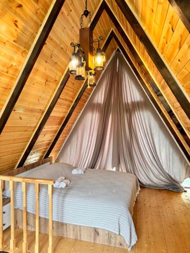 Postel nebo postele na pokoji v ubytování Cottage Kedkedi Machakhela