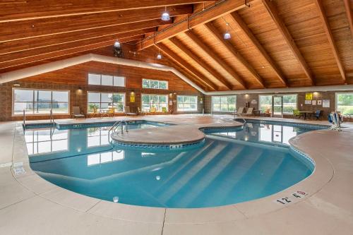 a large indoor swimming pool in a building at Comfort Suites Coralville I-80 in Coralville