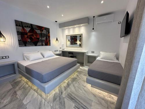 Posteľ alebo postele v izbe v ubytovaní Aphrodite Hotel & Apartments