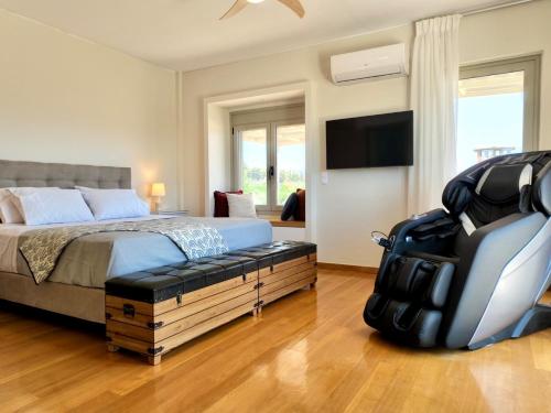 Ένα ή περισσότερα κρεβάτια σε δωμάτιο στο Villa Vakoufia