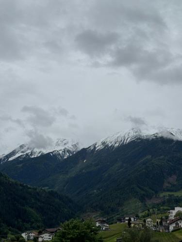 a view of a mountain range with snow covered mountains at Ferienwohnung Raich in Wenns