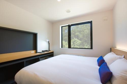 Una cama o camas en una habitación de Always Niseko
