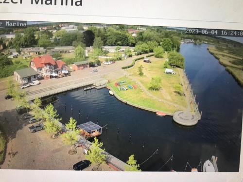 an aerial view of a park and a lake at Glampingpod in Loitz