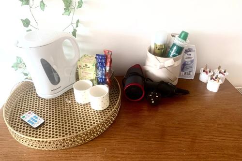 a table with a coffee pot and cups on it at Large room in excellent location double or two singles in Dublin