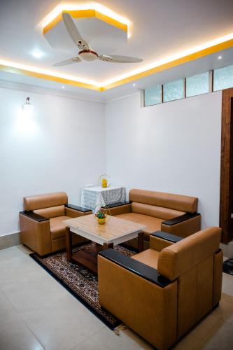 a living room with a couch and a table at HOTEL COUNTRY INN in Dimāpur