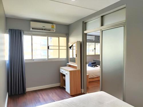 Postel nebo postele na pokoji v ubytování Impact DHIresidence at Muang Thong Thani
