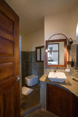 a bathroom with a sink and a tub at Mango Hill Yercaud in Yercaud
