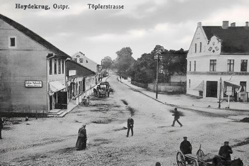 a black and white photo of people playing baseball in a street at Cosy place in historic building in Šilutė