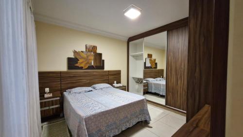 Ένα ή περισσότερα κρεβάτια σε δωμάτιο στο Casa Jardim