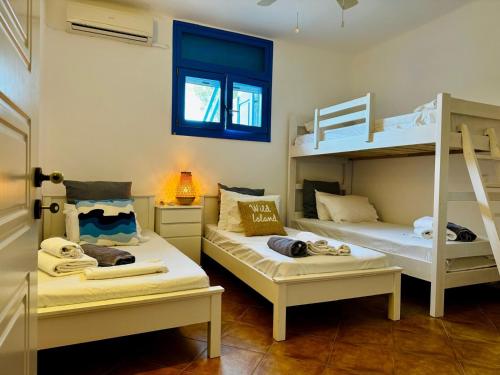 Postel nebo postele na pokoji v ubytování Paros Home