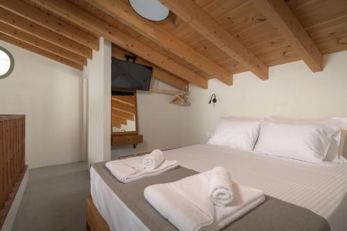 Postel nebo postele na pokoji v ubytování Onar Residences Chalki