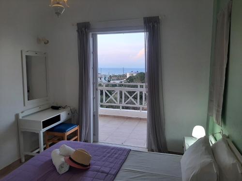 Ένα ή περισσότερα κρεβάτια σε δωμάτιο στο Remi Apartments