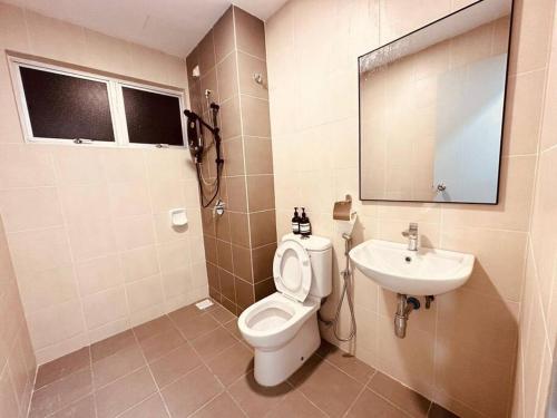 a bathroom with a toilet and a sink at Kuala Selangor 16pax, Karaoke ,End lot 3 Storey in Bukit Rotan