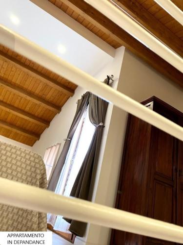 a room with a window with a curtain at Tenute Plaia Agriturismo in Scopello