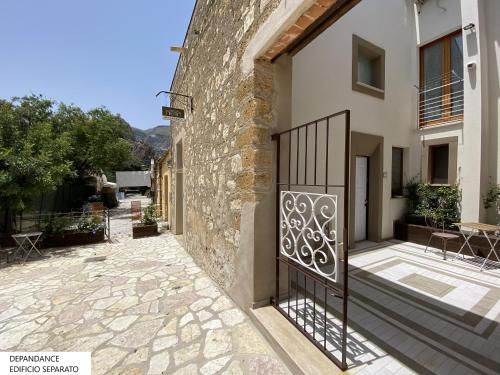 a gate on the side of a building at Tenute Plaia Agriturismo in Scopello