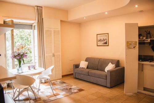 a living room with a couch and a table at Casa Paolina in Lucca