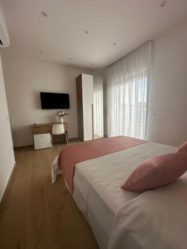 Ένα ή περισσότερα κρεβάτια σε δωμάτιο στο B&B Profumo di mare