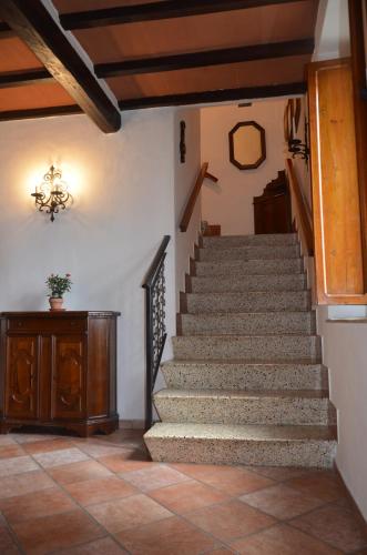 a stairway in a house with a stone staircase at Casa Anna in Castellina in Chianti