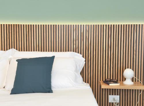 Ένα ή περισσότερα κρεβάτια σε δωμάτιο στο Magrì Comfort House